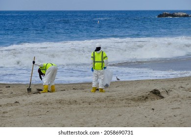 Oil Spill Clean Up Crew At The Beach