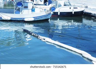 Oil Spill. Environmental Disaster. A Containment Boom Is A Temporary Floating Barrier Used To Contain An Oil Spill.