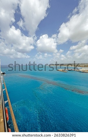 Oil spill in the turquoise waters of Bridgetown harbor Barbados showing marine pollution