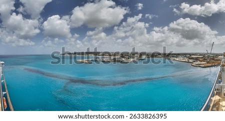 Oil spill in the turquoise waters of Bridgetown harbor Barbados showing marine pollution