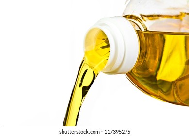 oil spilled from plastic bottle. Isolated on white background