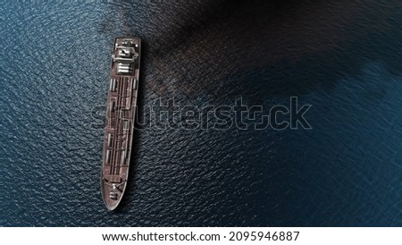 Oil spills out of a ship to Sea- Aerial high altitude View 
Drone view of Chemical Tanker ship spills oil in the ocean, global pollution concept,December 2021
