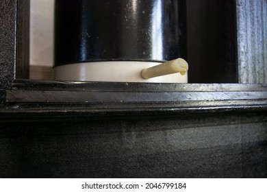 Oil spin press. Spout of barrel