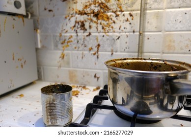 Oil stains on the walls, dirty stains on kitchen wall, Dirty Cooking. forgot to turn off the gas stove, condensed milk explosion - Shutterstock ID 2165277029