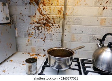Oil stains on the walls, dirty stains on kitchen wall, Dirty Cooking. forgot to turn off the gas stove, condensed milk explosion - Shutterstock ID 2165277031
