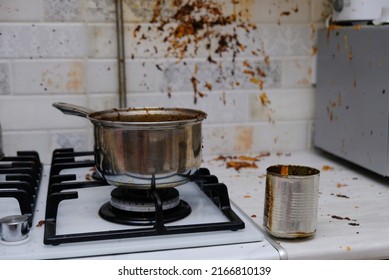 Oil stains on the walls, dirty stains on kitchen wall, Dirty Cooking. forgot to turn off the gas stove, condensed milk explosion - Shutterstock ID 2166810139