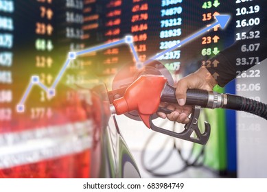 Oil stock market chart, Stock market data  with car fuels concept, oil station hand and fuel nozzle in car - Powered by Shutterstock