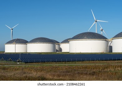 Oil Storage Tanks, Solar Panels And  Wind Turbines.