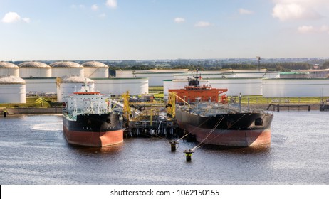 Oil Tankers Moored At An Petrochemical Oil Shipping Terminal In The Port Of Rotterdam.