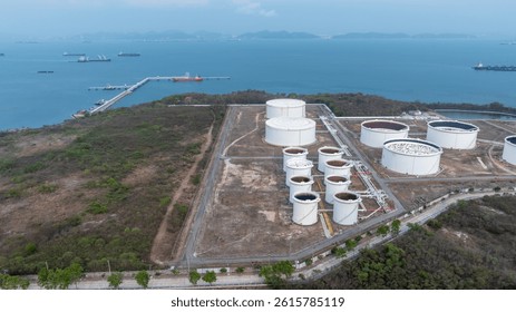 Oil terminal industrial facility storage tank, Oil storage tank with oil terminal port loading arm cargo oil product tanker ship, Global business refinery industry commercial port.