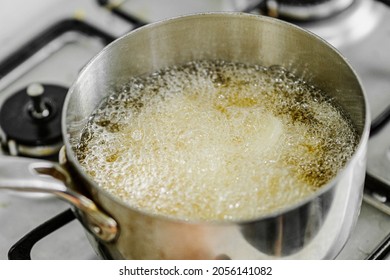 oil thermometer fried in olive oil - Shutterstock ID 2056141082
