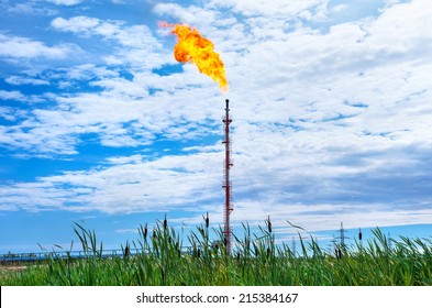 Oil torch on background of cloudy sky