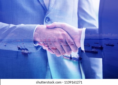 Oil Trader And Businessmen Making Handshake In Oil Wells / Business Partners - Merger And Acquisition Concepts