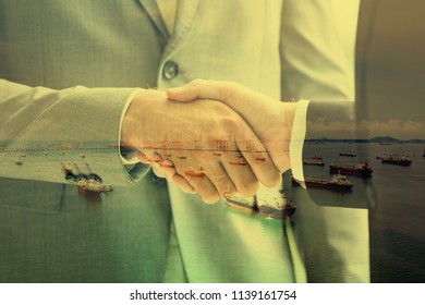 Oil Trader And Businessmen Making Handshake In Oil Wells / Business Partners - Merger And Acquisition Concepts