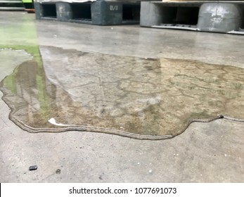 oil or water leak on concrete floor,(working area) careful danger and accident.