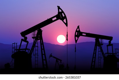 oil well plant against sunset