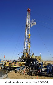 An Oil Well Servicing Rig Sets Up In Kern County California