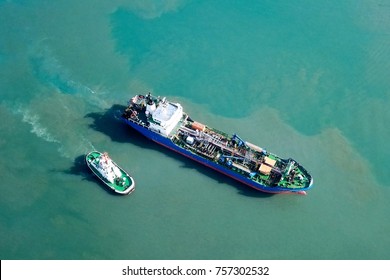 Oil/Chemical Tanker Pulled By A Tug Boat - Aerial View