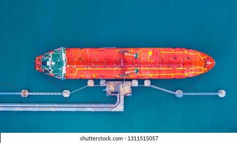 Oil/Chemical tanker ship loading in port, Tanker ship under cargo operation logistic import export business and transportation, Aerial view.