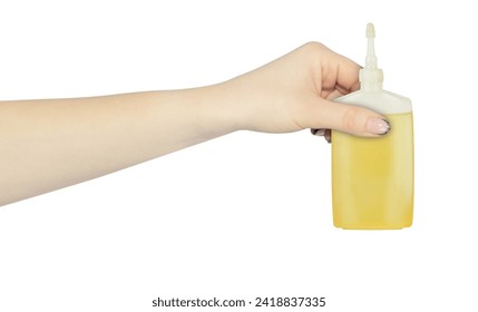 oiler, pipette with mechanical oil in hand, outstretched hand with oiler isolated from background	