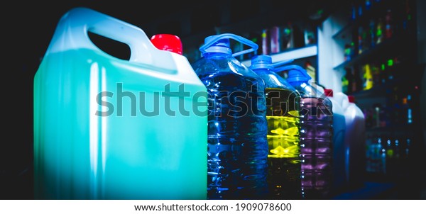 oils and\
liquids in plastic containers in a car\
shop