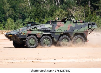 OIRSCHOT, EINDHOVEN, THE NETHERLANDS - JUNE 24, 2020: A Boxer Armoured Fighting Vehicle Of The Royal Netherlands Army Is Driving In The Sand At The GLV-V, Oirschot.