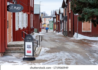 Ojebyn, Sweden - April 2020: Main Street of Ojeby church town outside of Pitea, Sweden.  Small wooden buildings, residents to people visiting the church on Sundays.