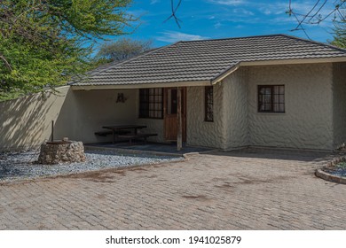 OKAUKUEJO, NAMIBIA - JANUARY 14, 2020 : Okaukuejo resort with thatched roof houses and campsite in Etosha National Park