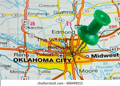 Oklahoma City highlighted with push pin on atlas or map