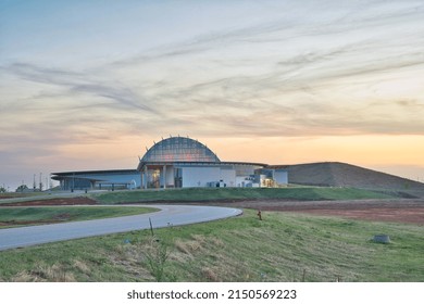 Oklahoma City, OK, USA - April 21 2022: View Of First Americans Museum From Entrance Road With FAM Mound And Hall Of The People At Dusk