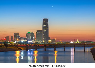 Oklahoma City, Oklahoma, USA downtown skyline on the Oklahoma River at dusk.