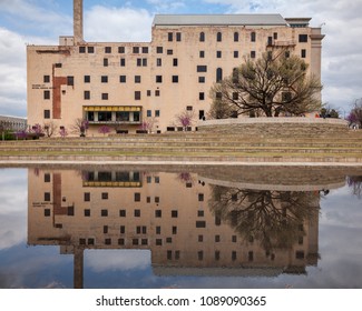 OKLAHOMA CITY, OKLAHOMA / USA - MARCH 31, 2018: Oklahoma City National Memorial Museum Building Reflecting In The Shallow Pool On A Clear Winter Day.