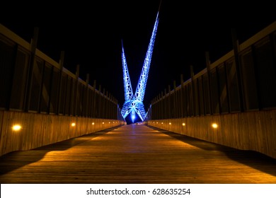 Oklahoma City Wooden Bridge walk way lit up at night over the highway interstate - Long exposure photography
