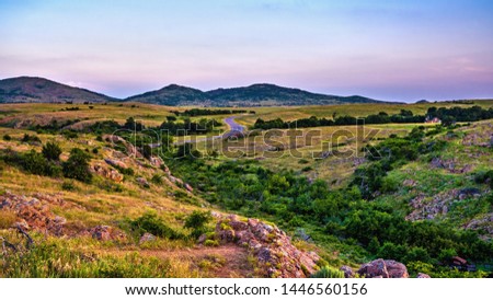 Oklahoma landscape at sunset.  Wichita Mountain Wildlife Preserve, Lawton, Oklahoma, United States. 