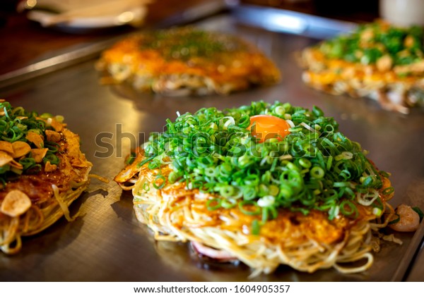Okonomiyaki, Hiroshima\
food with egg, Japan\
