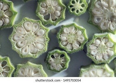 Okra And It's Seeds On A White Slates, Above Vantage Point, Macro Photography, Close Up