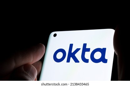 Okta security firm logo seen on smartphone. Concept for hack. Stafford, United Kingdom, March 22, 2022.