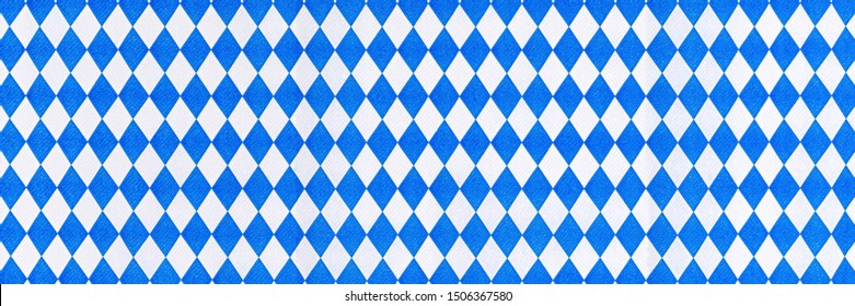 Oktoberfest background with bavarian white blue paper, banner. October fest background, text place, copy space. Bavaria State flag fabric table cloth. Oktoberfest cloth paper runner