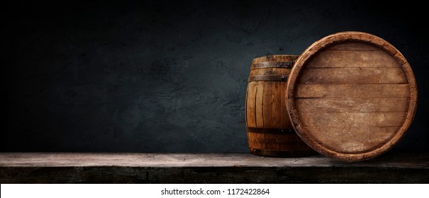 Oktoberfest beer barrel and beer glasses with wheat and hops on wooden table - Shutterstock ID 1172422864