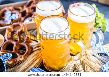 Oktoberfest beer with bavarian pretzels and obatzter Dip chesse cream
