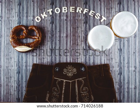 Oktoberfest beer festival on rustic background. Flat lay style. 
