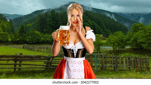 Oktoberfest Girl Waitress With Beer. Woman Wearing A Traditional Bavarian Or German Dirndl On Octoberfest, Serving Big Mugs With Drink On Mountains Background.