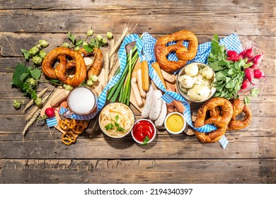 Oktoberfest Holiday Greeting Card, Menu, Invitation Background, Traditional Oktoberfest Festival Food, Bavarian Sausages, Pretzels, Potato, Sauerkraut, Beer Mug On Wooden Background, Copy Space Above