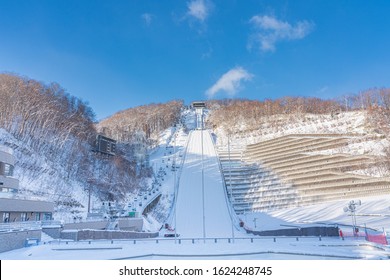 Okurayama Ski Jump In The Sunny Day And Blue Sky, View From The Below Of Mt. Okura In Winter At Sapporo, Hokkaido, Japan