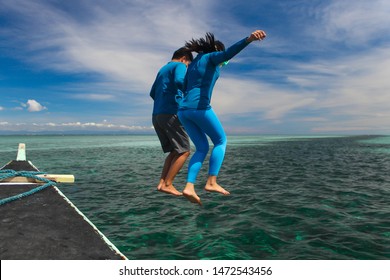 Olango Island, Lapulapu,Cebu / Philippines - March 16, 2018: Jump Up From The Boat Into The Sea