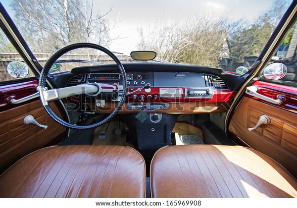 Old 1970s French car Citroen interior - panel drive\
- in red.