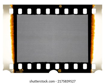 Old 35mm filmstrip or dia slide frame with burned edges isolated on white background. Real analog film scan with signs of usage. - Shutterstock ID 2175839527