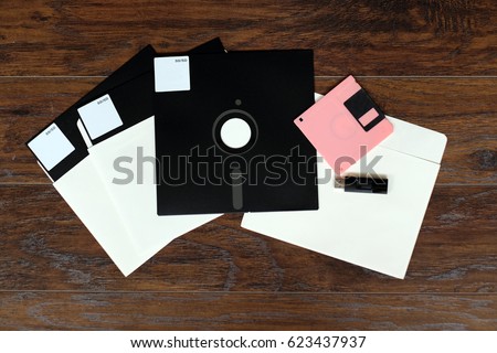 The old 8-inch floppy disk, for an old computer, a comparison with the flash drive