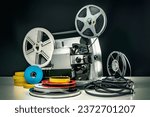 old 8mm film projector with several reels