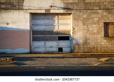 Old Abandoned Building With Broken Garage Door